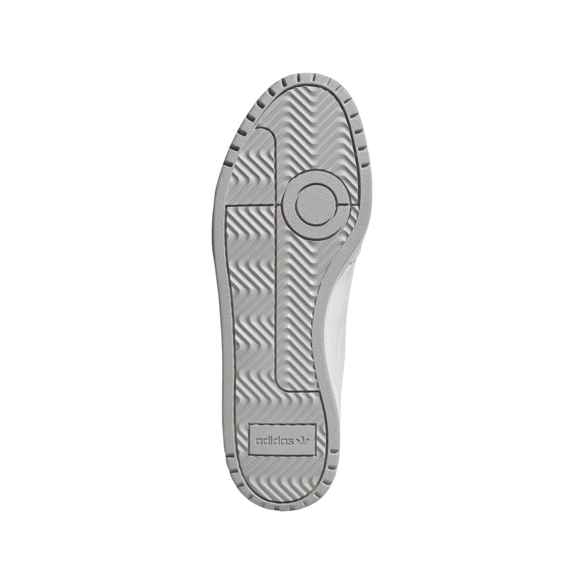 Rubber outsole of white adidas NY 90 trainers with tread and adidas branding.
