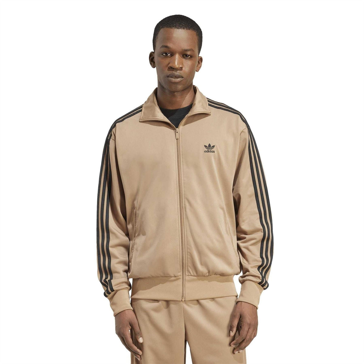 Tan track jacket back view with stand collar, black side stripes, ribbed waistband.