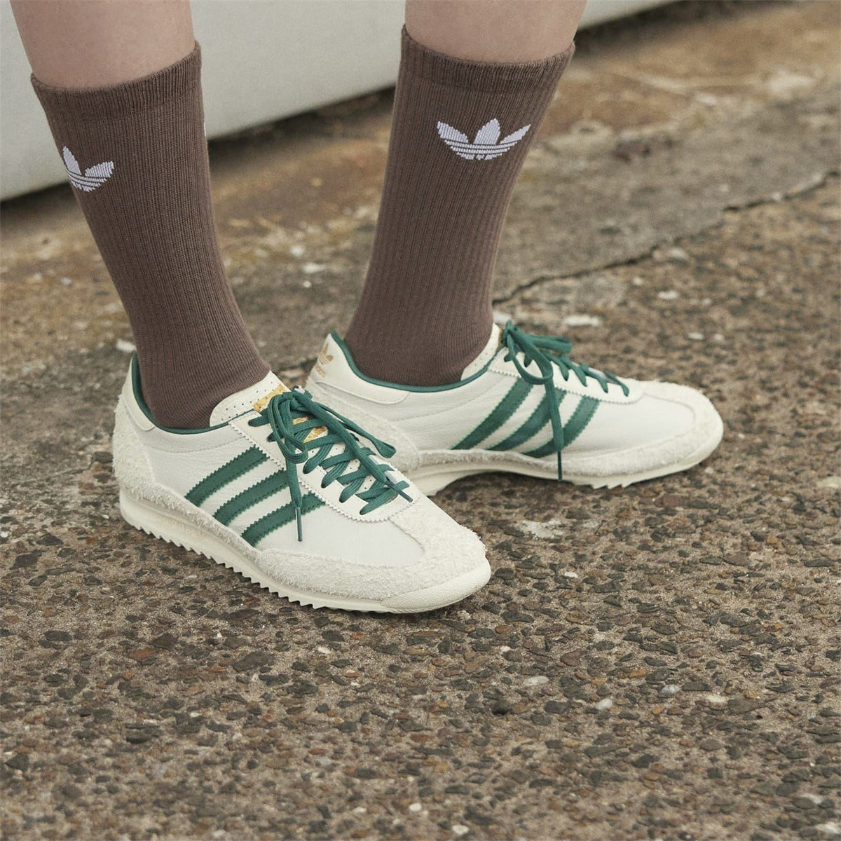 adidas Originals Sl72 shoes in white and navy with classic low-top design and retro style, displayed on a neutral background