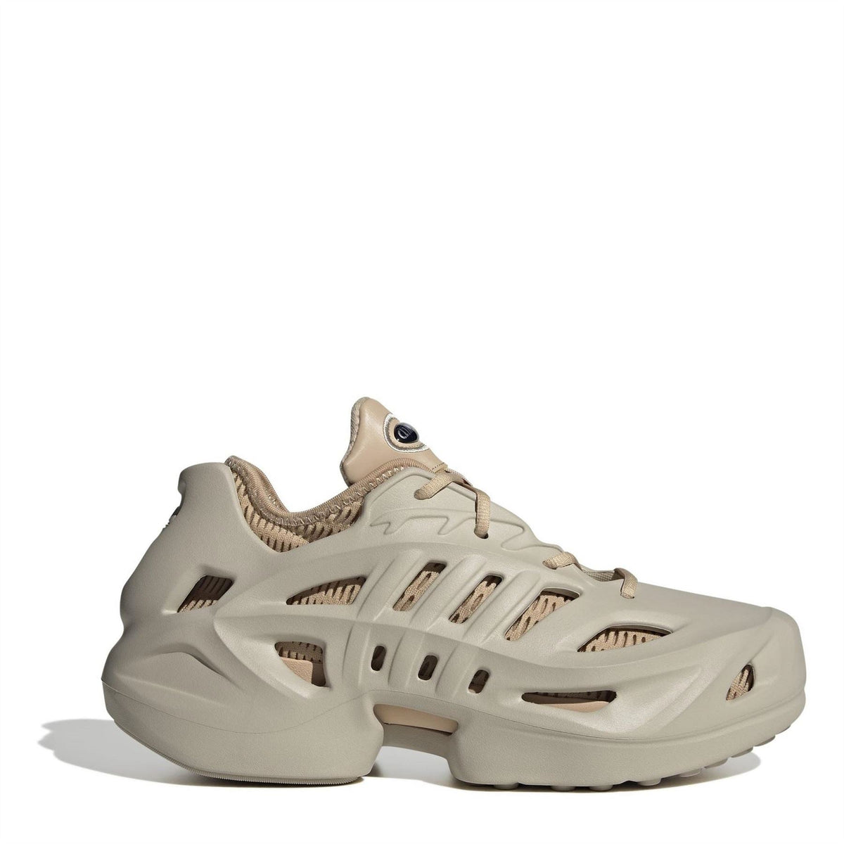Beige adidas Adifom low-top sneakers, side view with ventilated panels