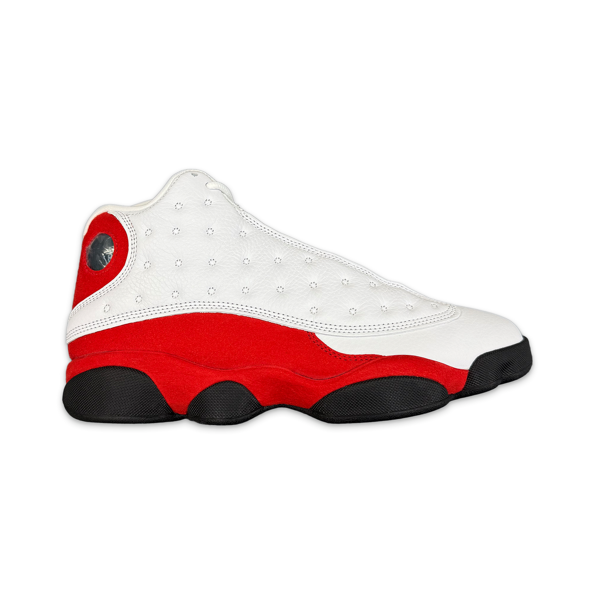 Air Jordan 13 Retro OG Chicago sneaker with white perforated upper, red side panels, black sole