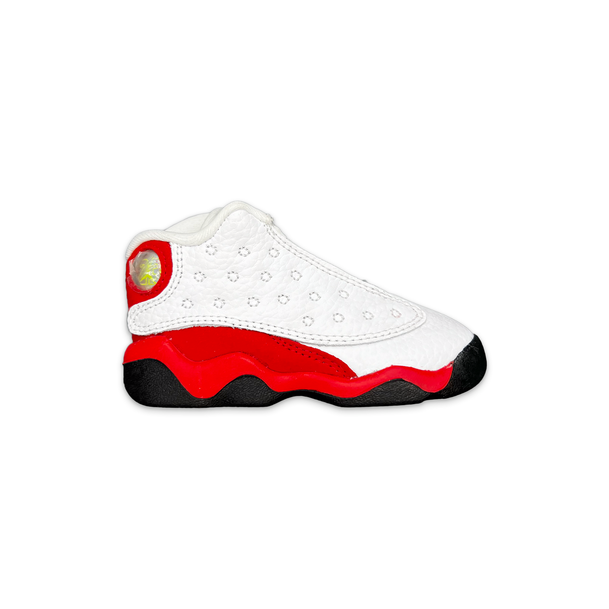 Toddler Air Jordan 13 retro sneaker with white upper, red panels, and black sole