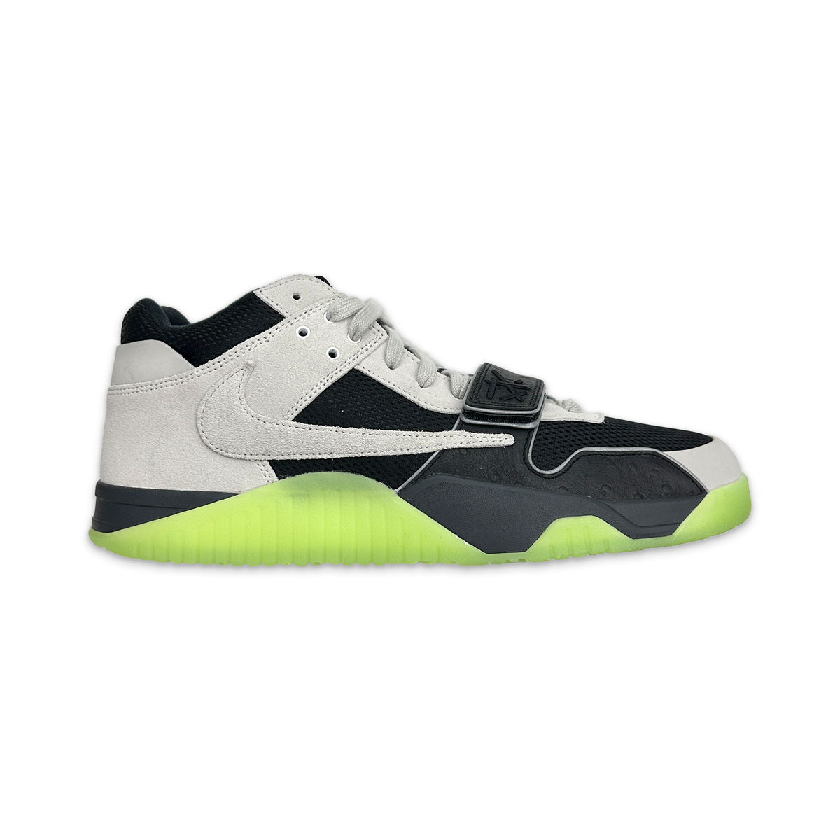 Low-top sneakers in white and black with neon green sole and side swoosh detail