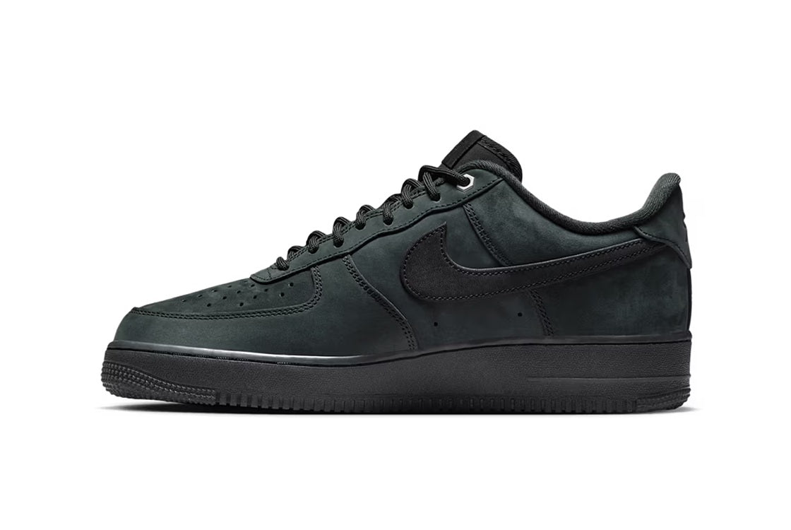 Men's low-top sneakers, side view, dark suede with lace-up and padded collar