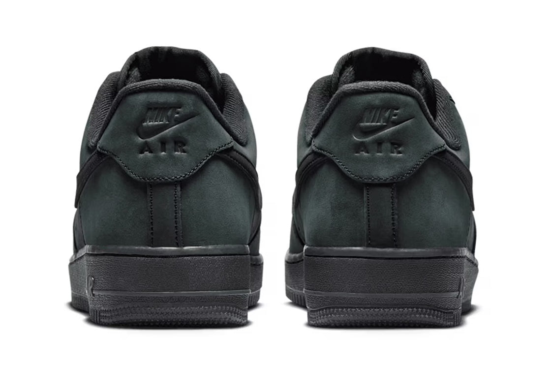 Men's sneakers rear view with padded heel, Air branding, and pull tab
