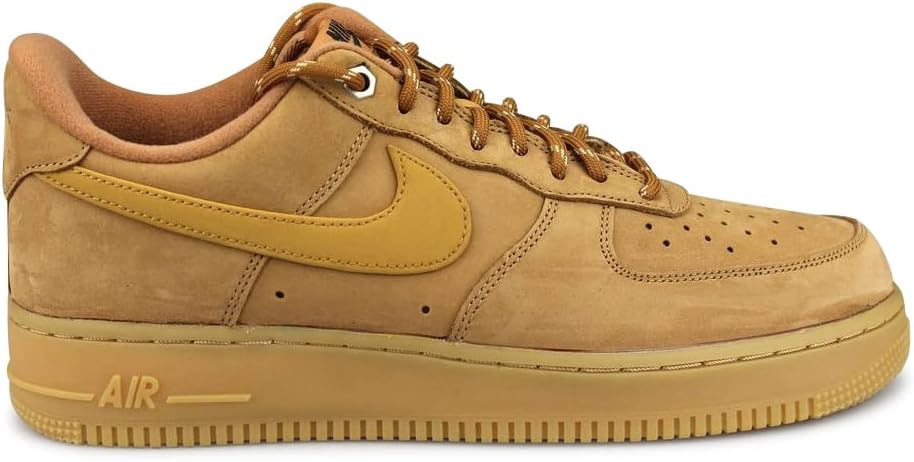 Men's Nike Air Force 1 low-top sneakers in tan suede with yellow swoosh and gum sole