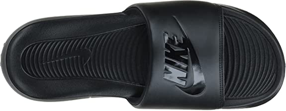 Black Nike slide sandals with ribbed strap and logo detailing