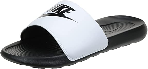 Black and white Nike slide sandals with single strap and contoured footbed