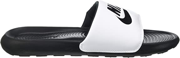 Black and white Nike slide sandal with white strap, swoosh logo, and tread sole