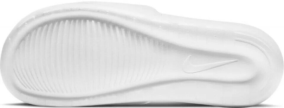 White Nike slide sandal outsole with textured tread and smooth midsole edge