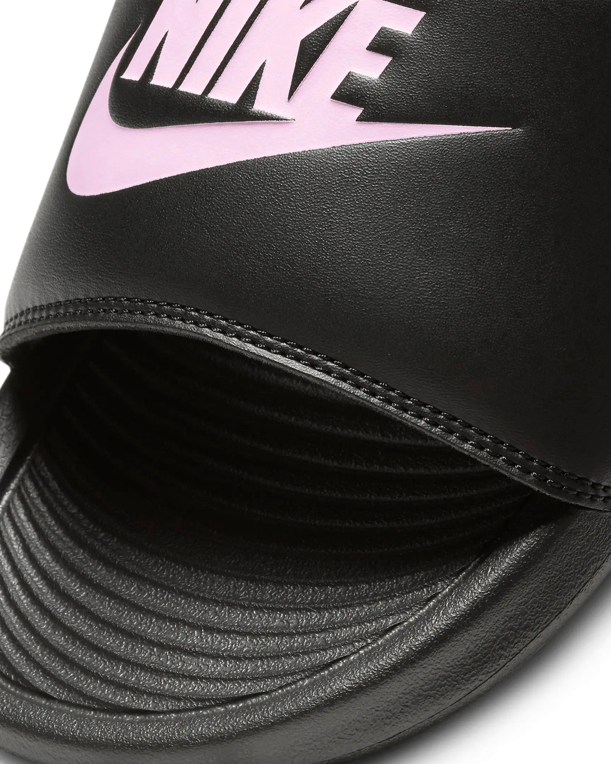 Black slide sandal upper with pink Nike swoosh logo and stitched edge