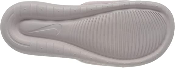 Women's Nike slide sandals outsole bottom in barely rose with textured traction