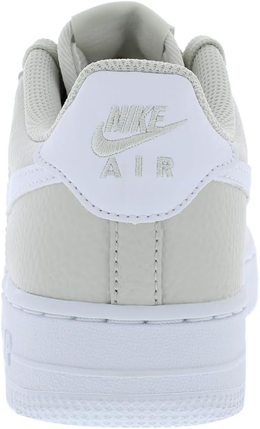 Big kids Nike Air Force 1 heel with Nike Air label on light bone tongue tab