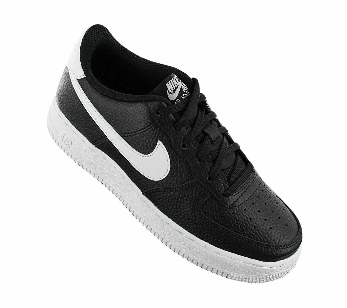 Black kids Nike sneaker with white swoosh, perforated toe, and lace-up