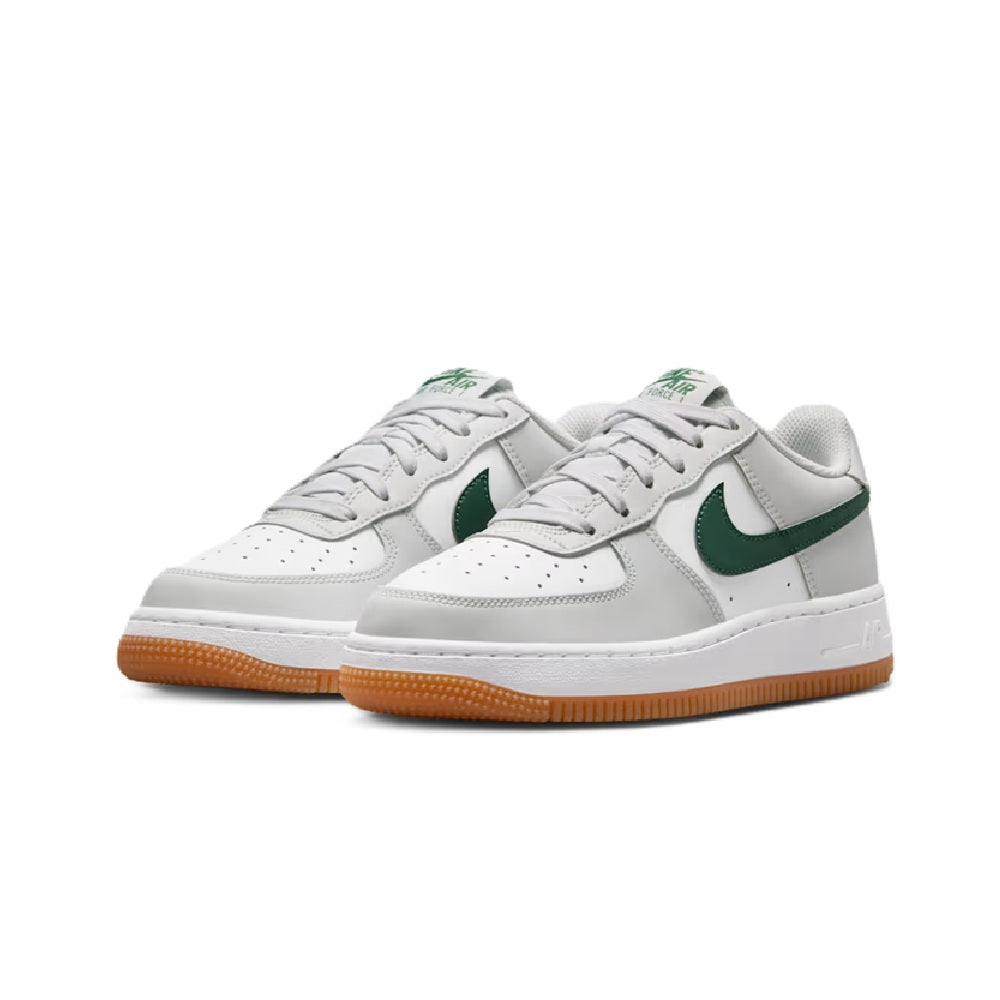 Kids' Nike Air Force 1 sneakers, two shoes front view in white with green swoosh