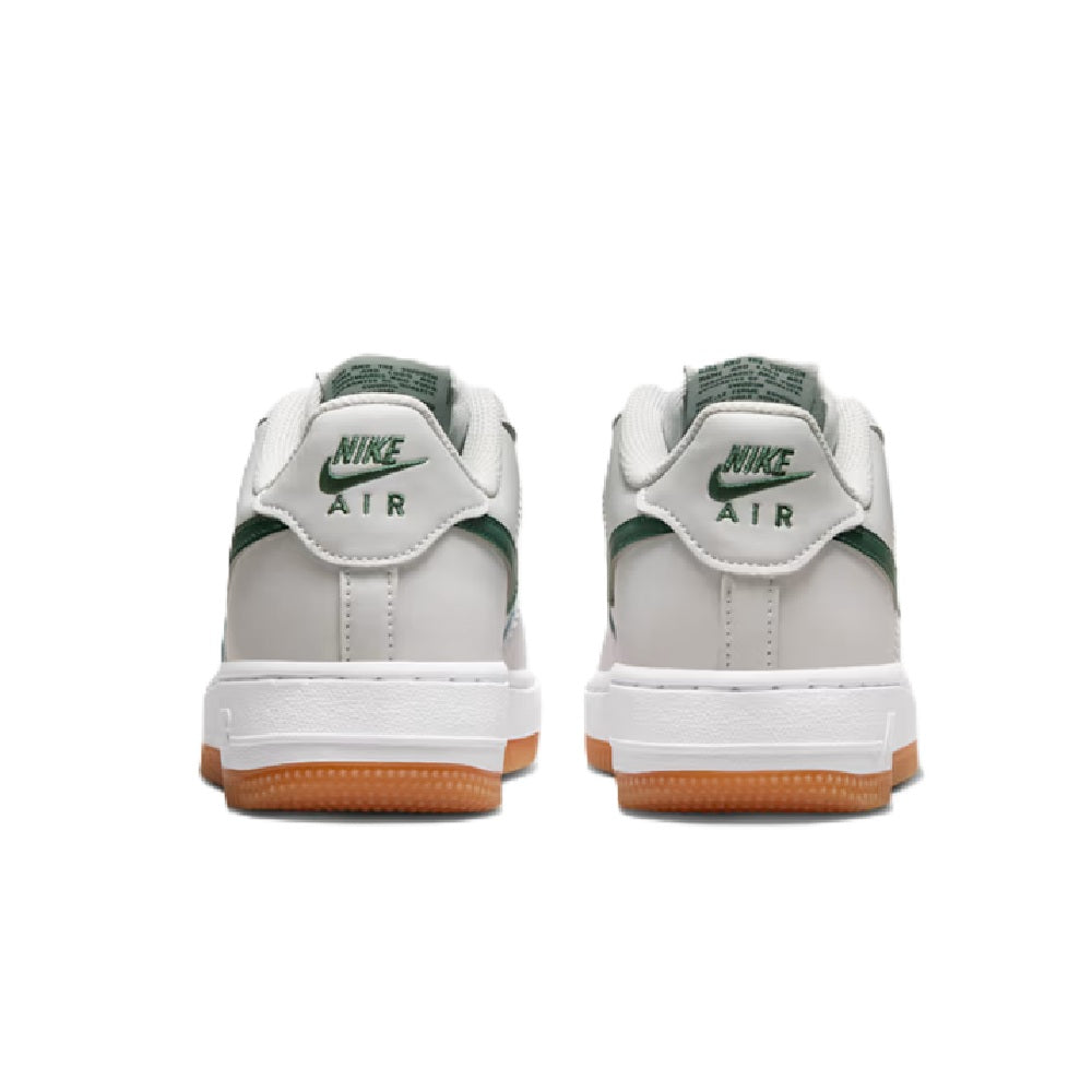 Kids' Nike Air Force 1 sneakers, heel view with Nike Air logo and green accents