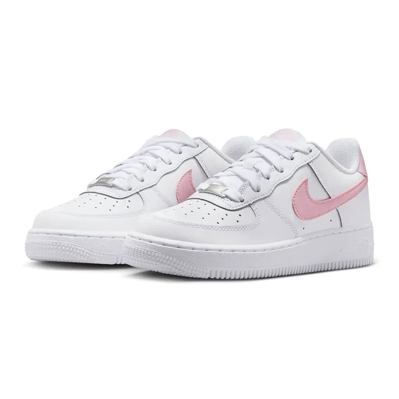 Pair of kids' Nike Air Force 1 low-top sneakers, white with pink swoosh, side view