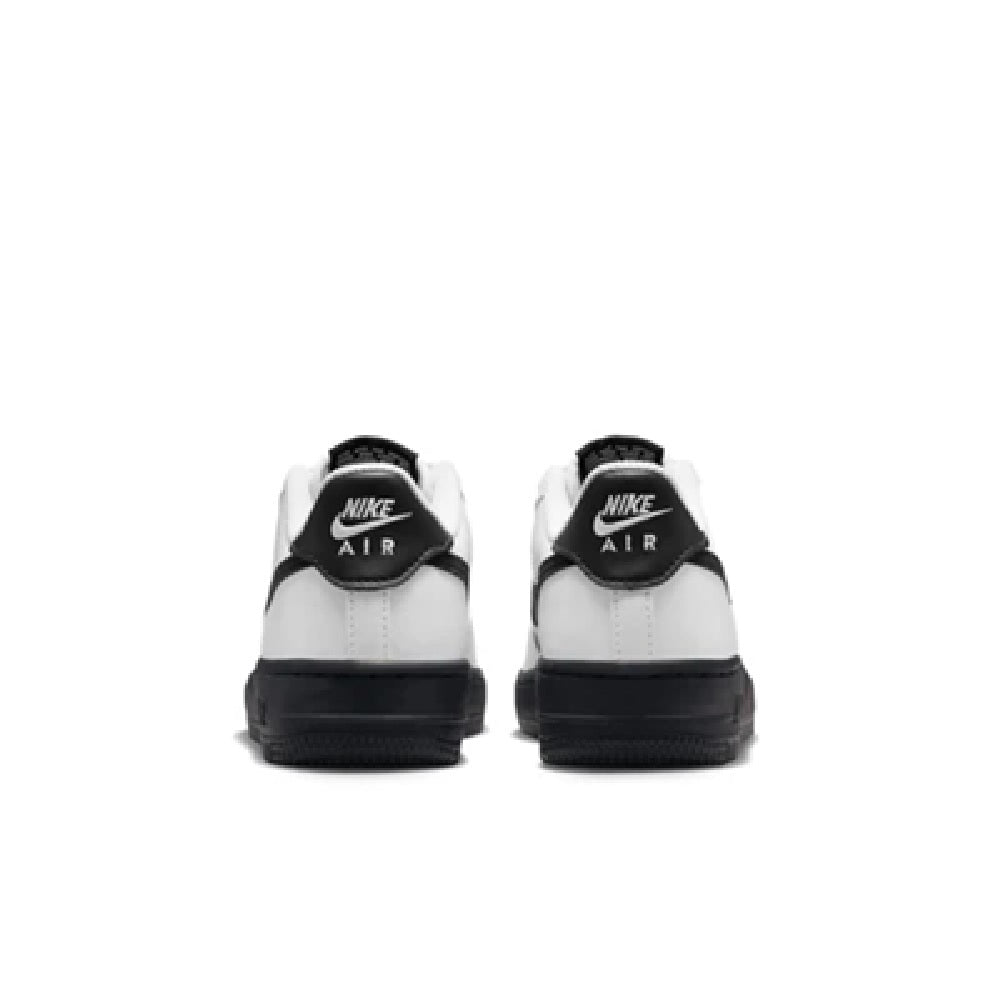 Kids' Nike Air Force 1 low-top sneakers, white back with black heel tabs and Nike Air text.