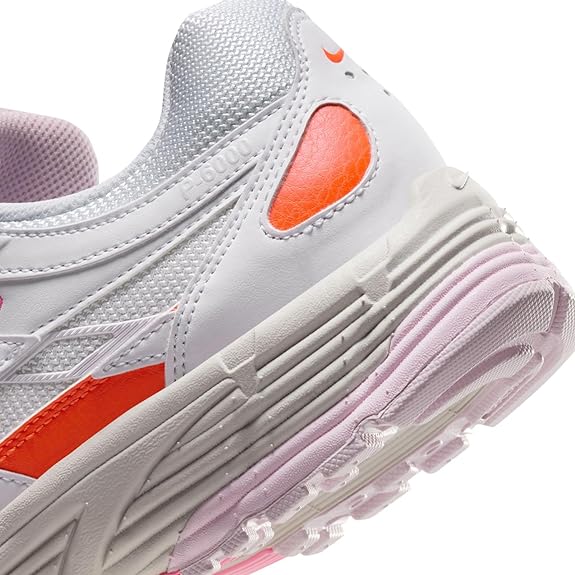 Nike women's P-6000 sneaker detail, white upper with orange side panel and pink outsole