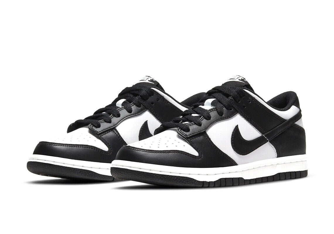 Black and white Nike Dunk Low sneakers, angled pair view with lace-up uppers