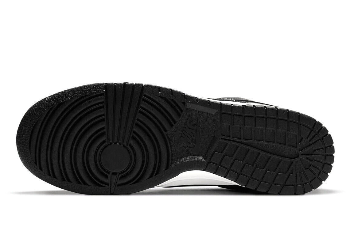 Black rubber outsole for Nike Dunk Low sneakers with circular traction pattern