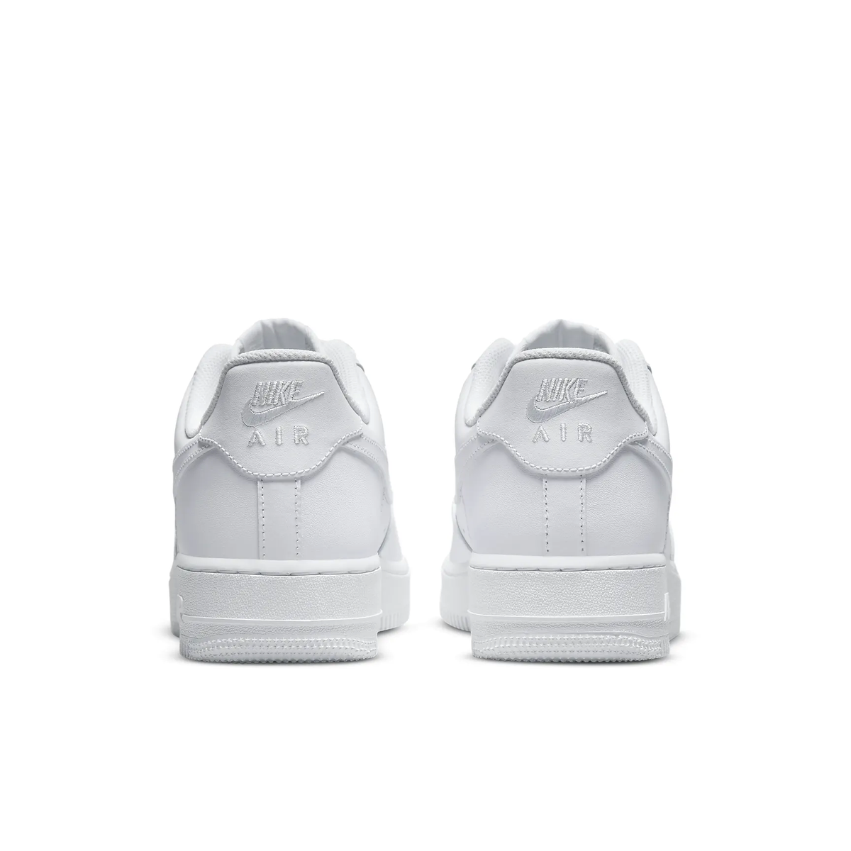 White Nike Air Force 1 sneakers with 'AIR' heel tab and padded heel