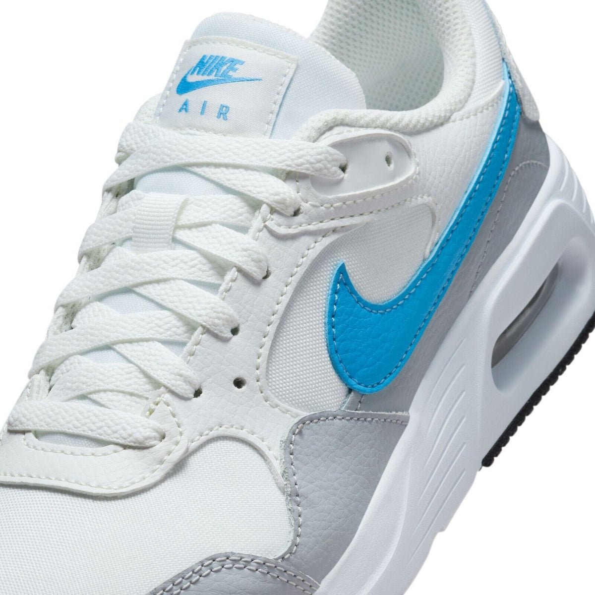 White Nike Air Max SC sneaker upper with blue swoosh, white laces, and padded tongue