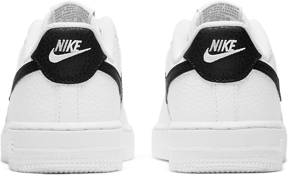 Kids' Nike Force 1 sneakers with black heel strap and white upper.