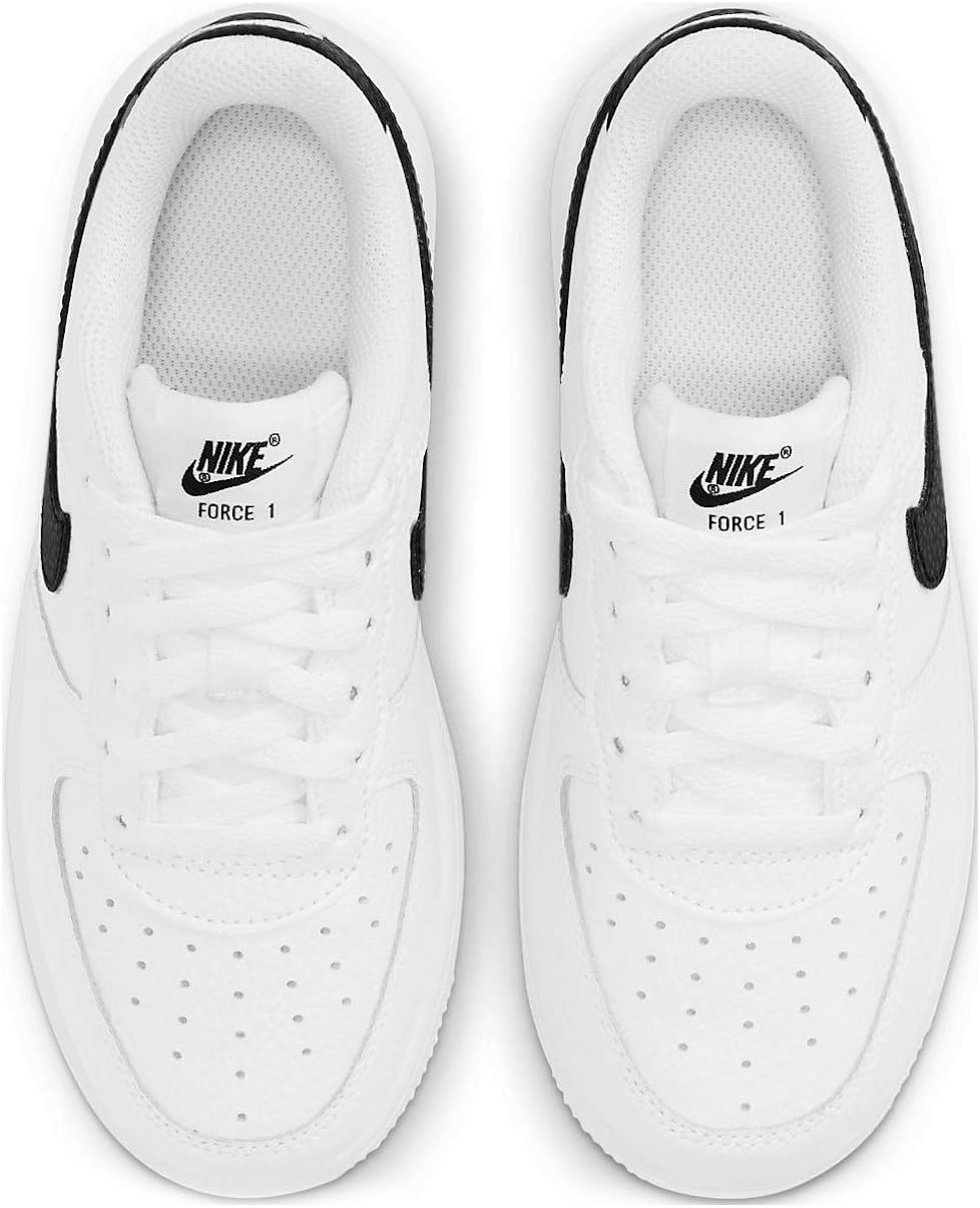 Kids' Nike Force 1 sneakers in white with black accents, toe and lace area visible.