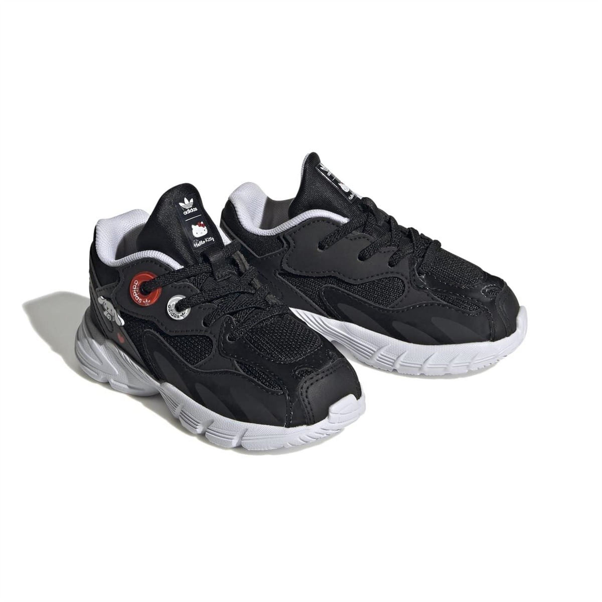 Black low-top trainers with white sole, lace-up front and decorative tongue label