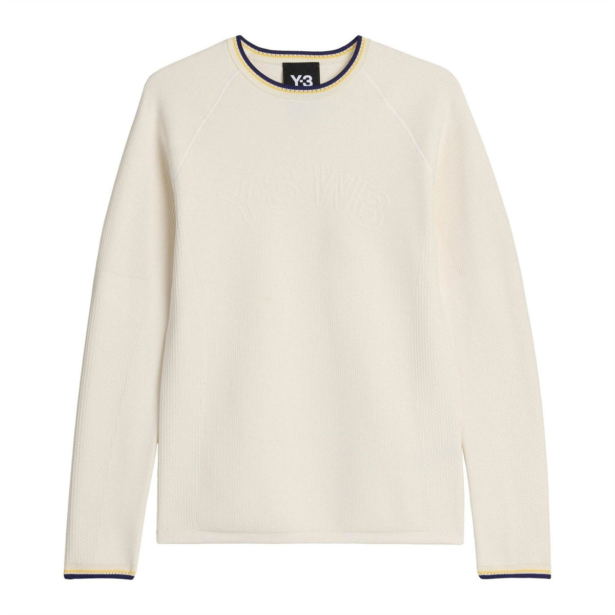 Cream knit long-sleeve crewneck top with navy and yellow trim at collar and cuffs