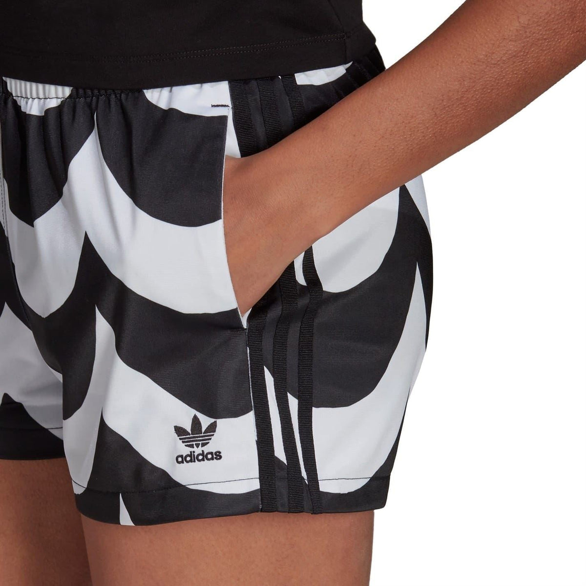 Black and white patterned shorts with adidas logo patch and adjustable drawcord