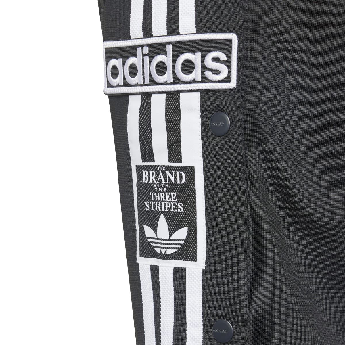 Black shorts with adidas patch and three-stripes logo on the side