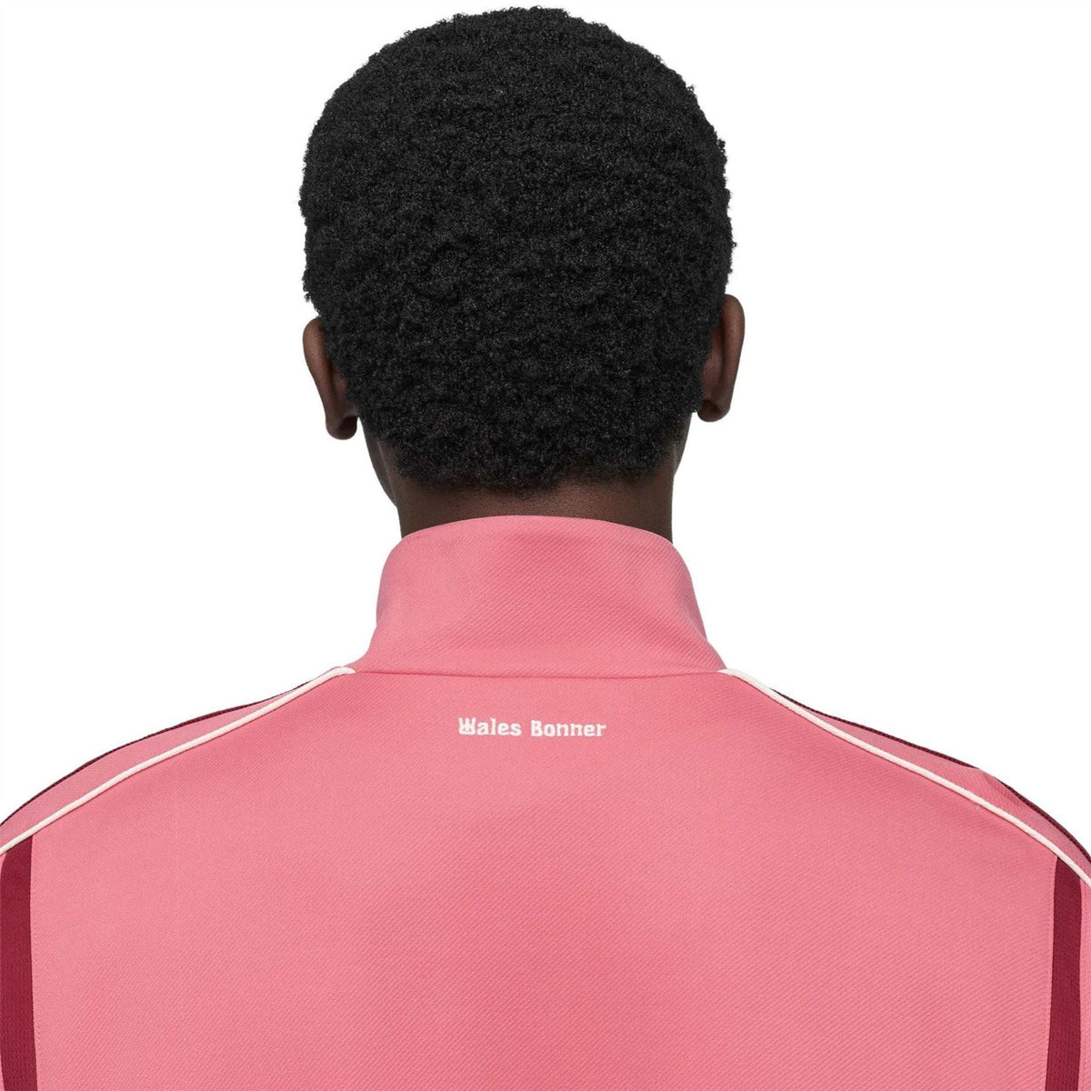 Pink track jacket back collar with Wales Bonner text and adidas-style stripes