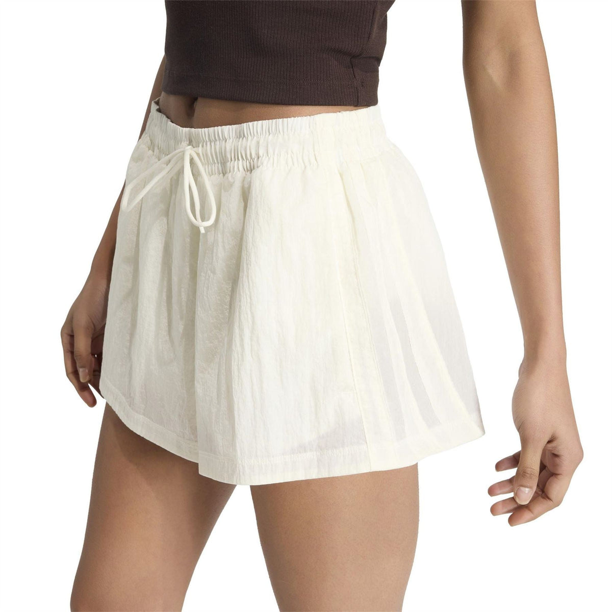 White woven track shorts with elastic waistband and hanging drawstring ties