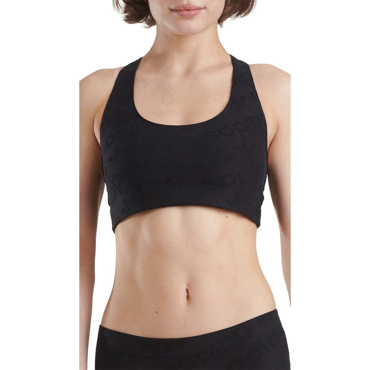 Women's black racer back crop top, scoop neck and racerback design with subtle logo texture.