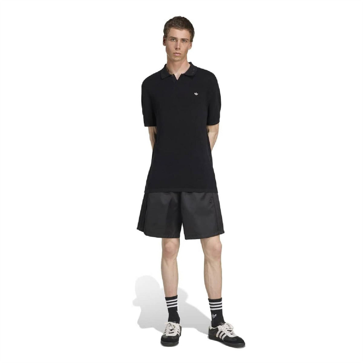 adidas Originals black polo shirt with ribbed collar, worn with black shorts