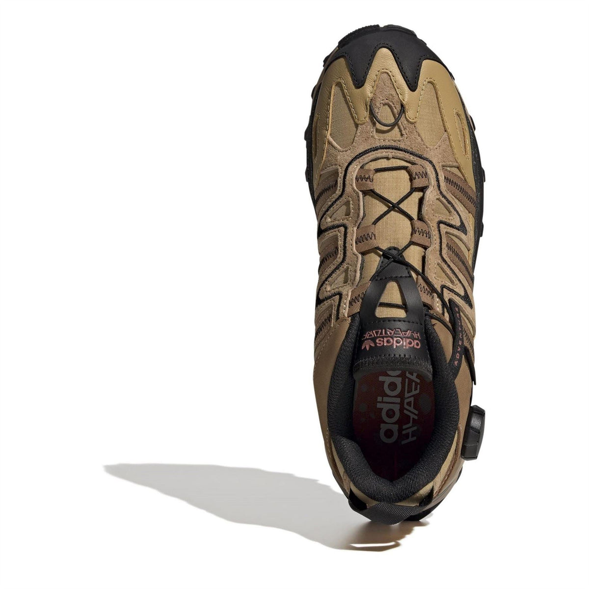Beige low-top sneaker heel and side view with lace-up detail and black overlays