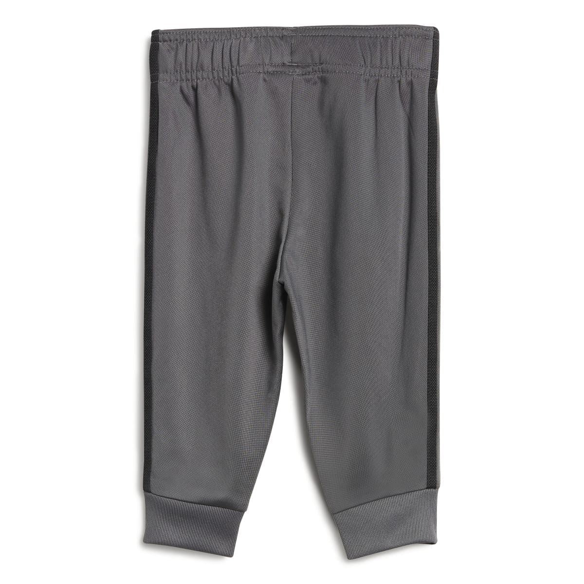Grey adidas infants track pants with elastic waistband, side stripes, and ribbed cuffs