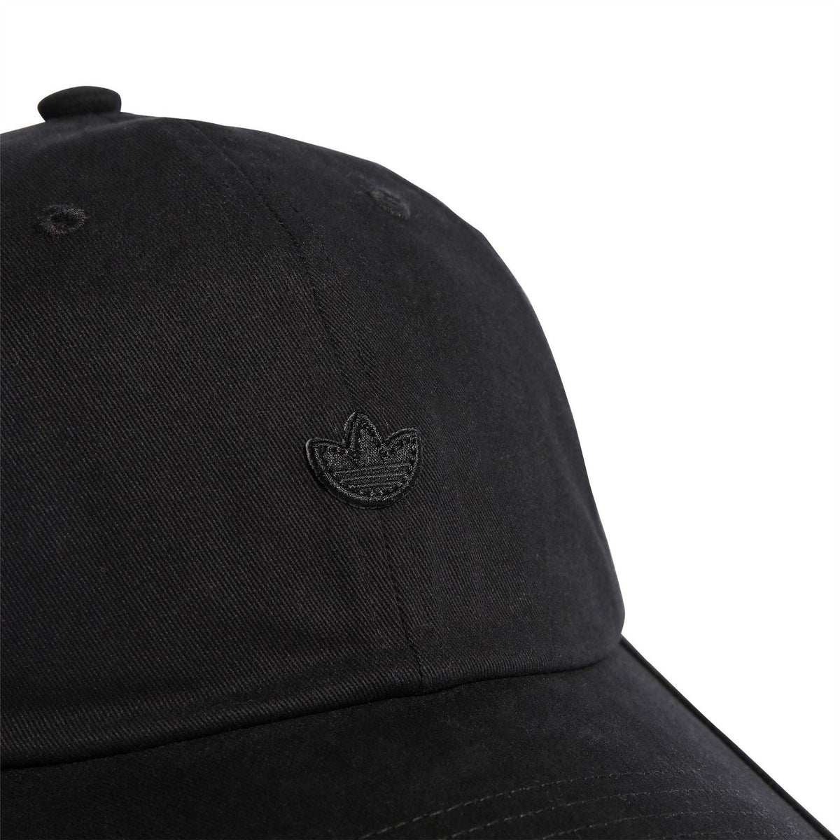 Black cap crown close-up with embroidered adidas trefoil logo and stitching