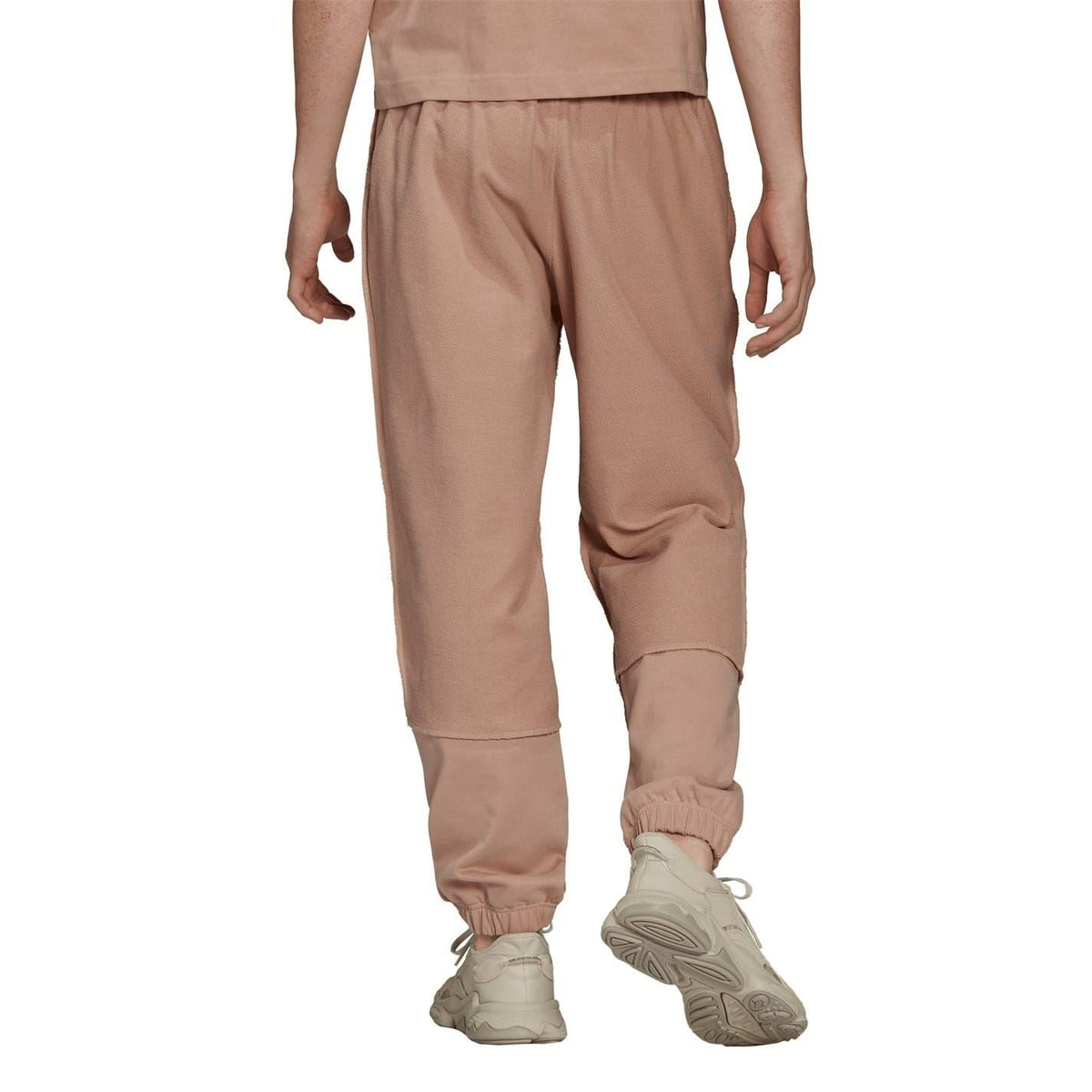 Dusty pink jogger pants with knee shaping and elastic ankle cuffs