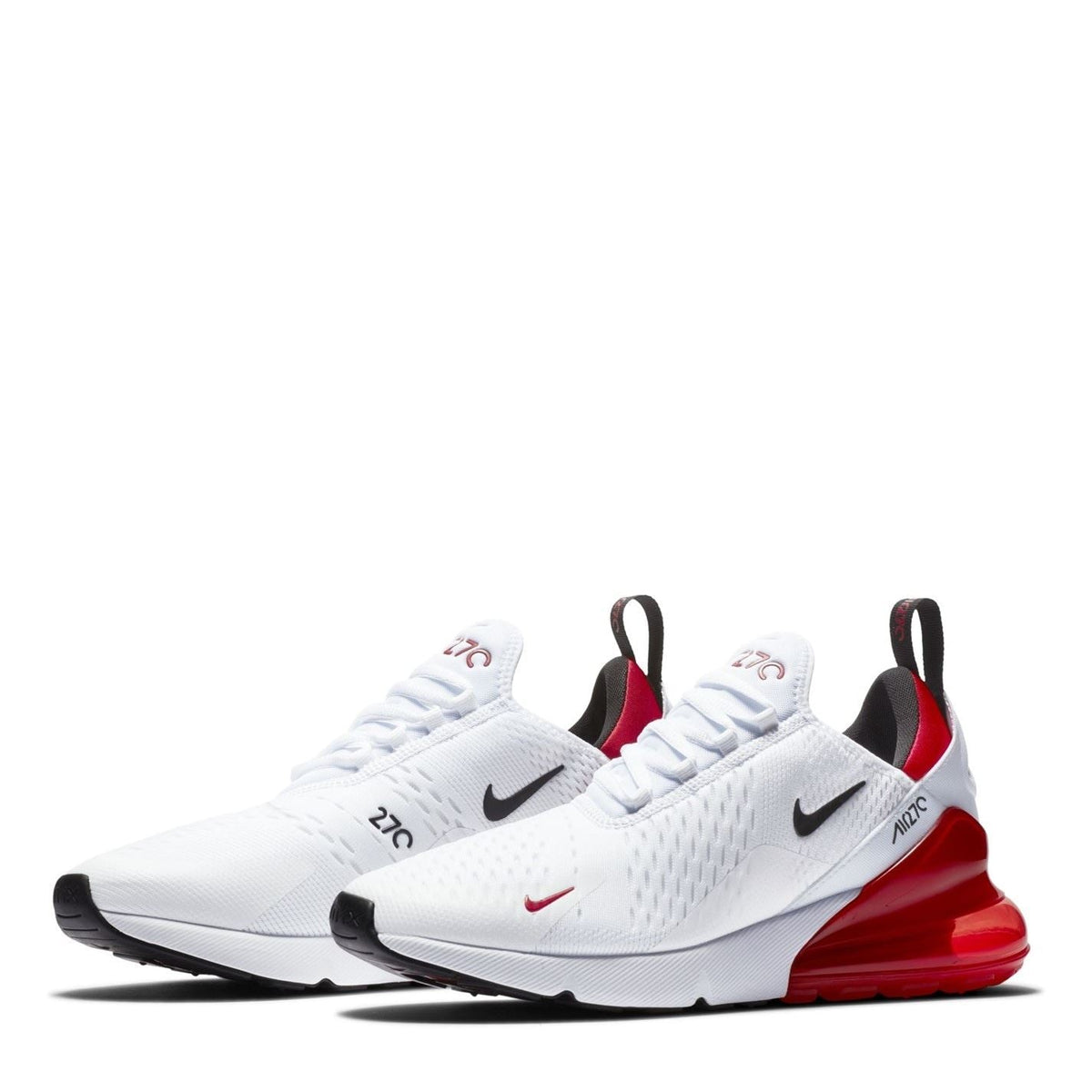 White Air Max 270 trainers pair with black heel accents and red Air sole