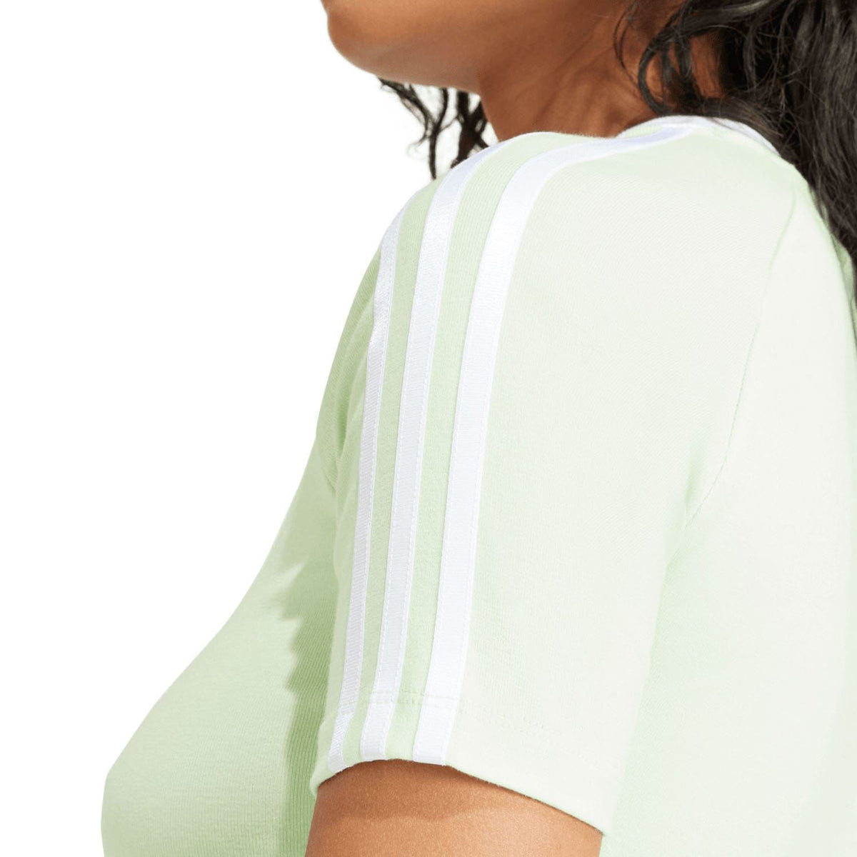 Pale green baby T-shirt back close-up with white adidas 3-stripe sleeve panel