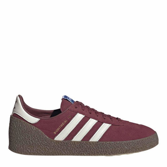Maroon low-top sneakers with white three stripes and textured dark rubber sole