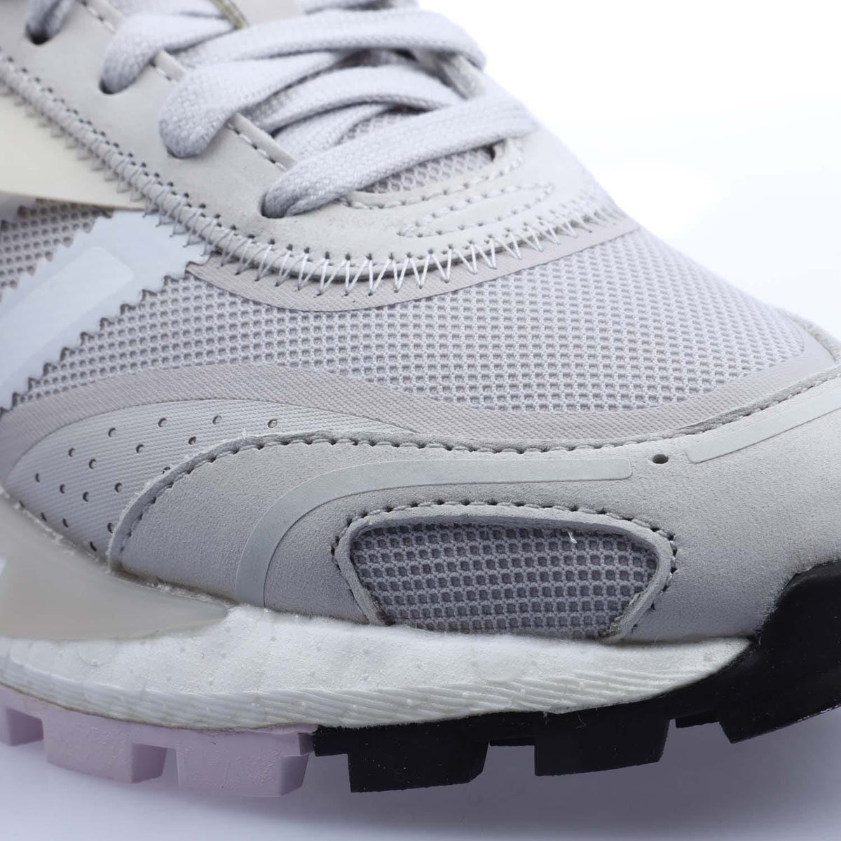 Close-up of grey adidas Originals womens trainer toe and lace area with grippy sole