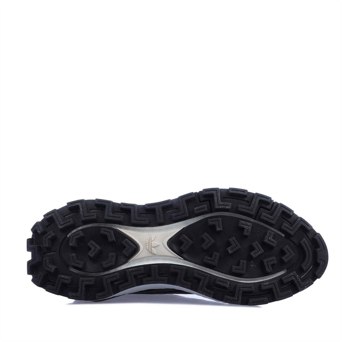 Rubber outsole for black low-top trainers with patterned traction tread