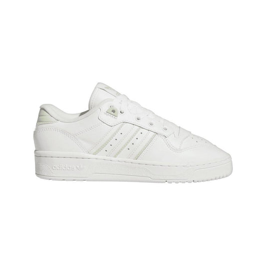 White low-top trainers with three-bar stripes and lace-up front, adidas Originals logo.