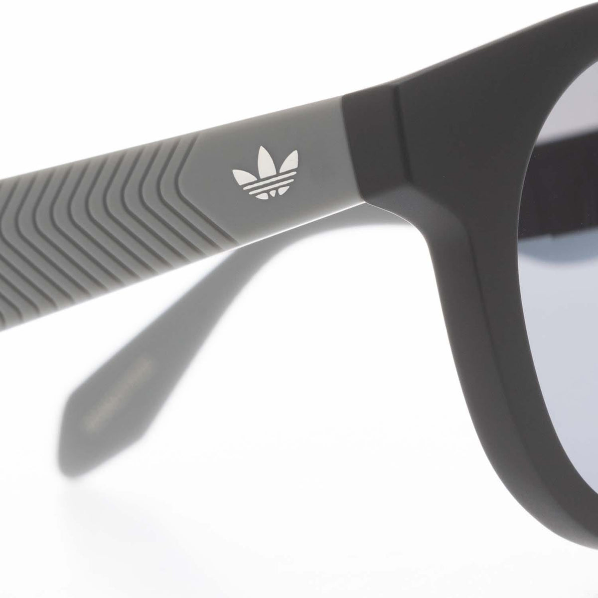 adidas Originals black temple detail with adidas logo and ribbed grip
