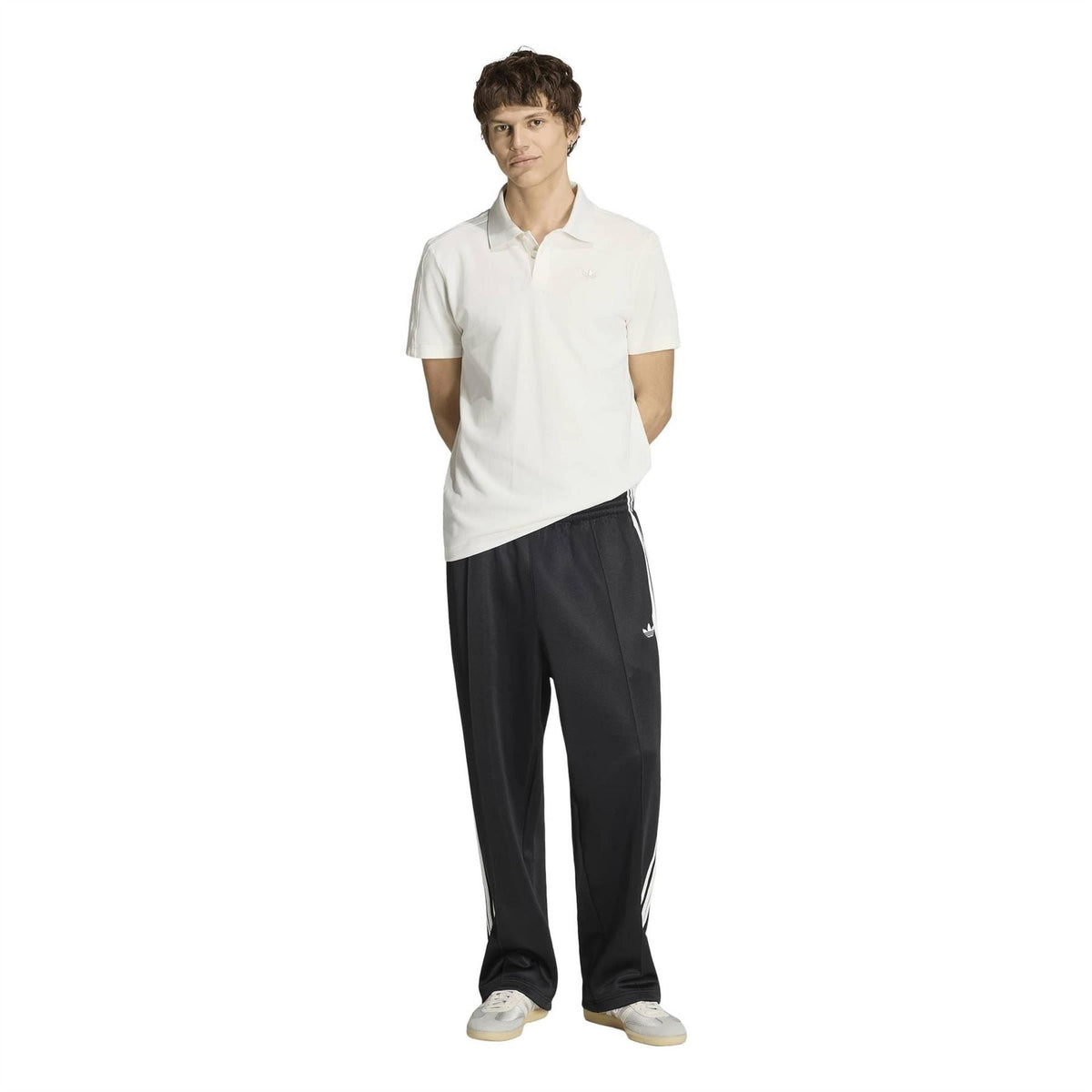 Cloud white polo shirt with collared neckline and adidas trefoil at the chest