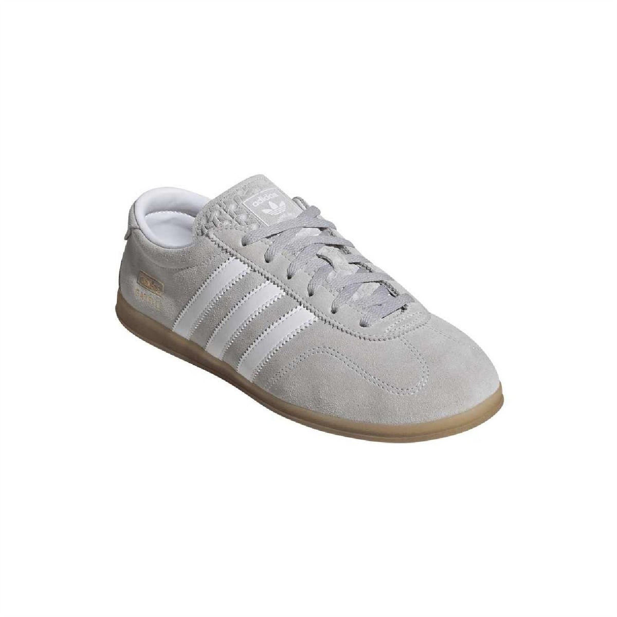 Grey suede Gazelle Lo Pro trainers, angled side view with textured stripes